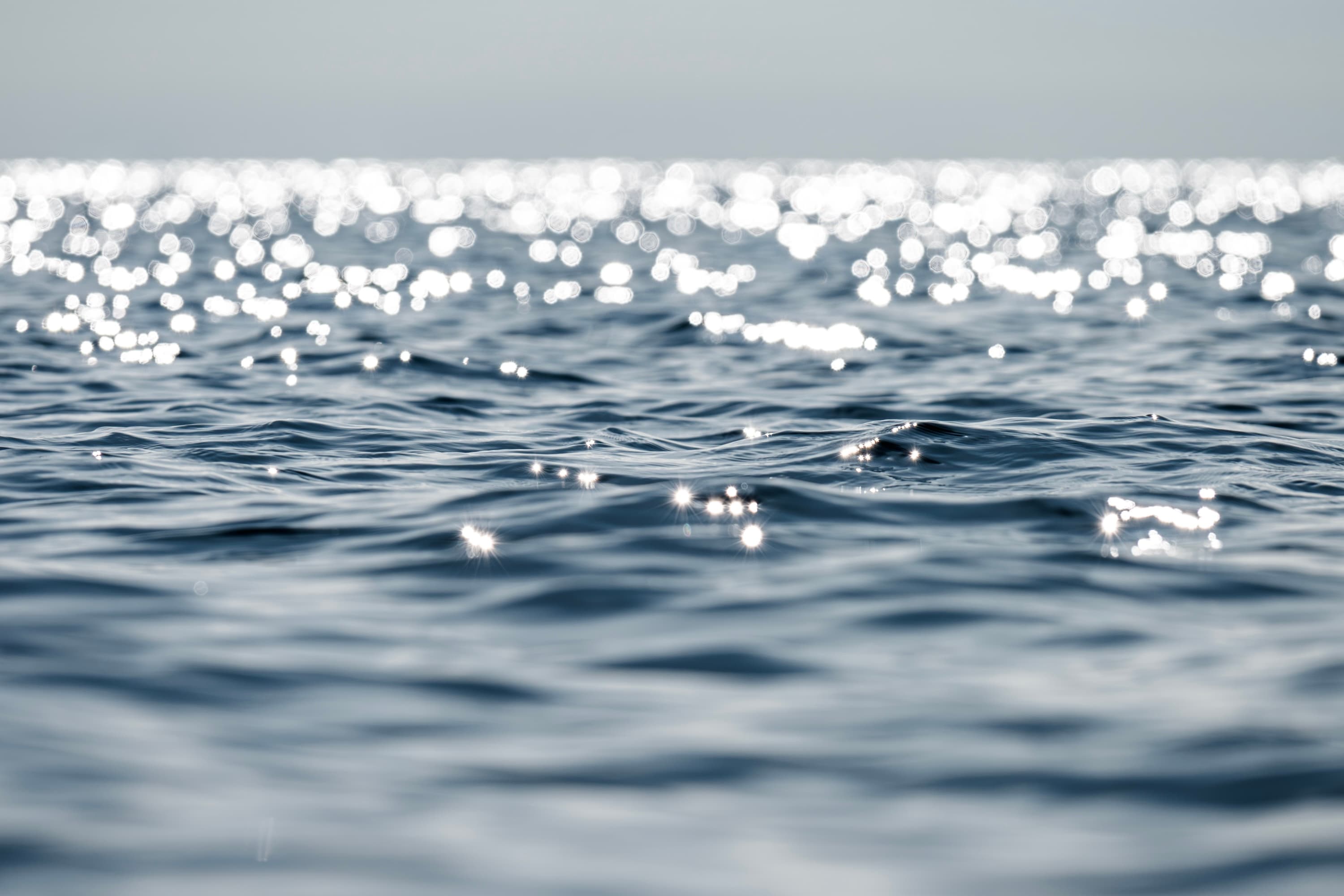 Reflections and light patterns on calm water — fine art ocean photography by Maison TALI.