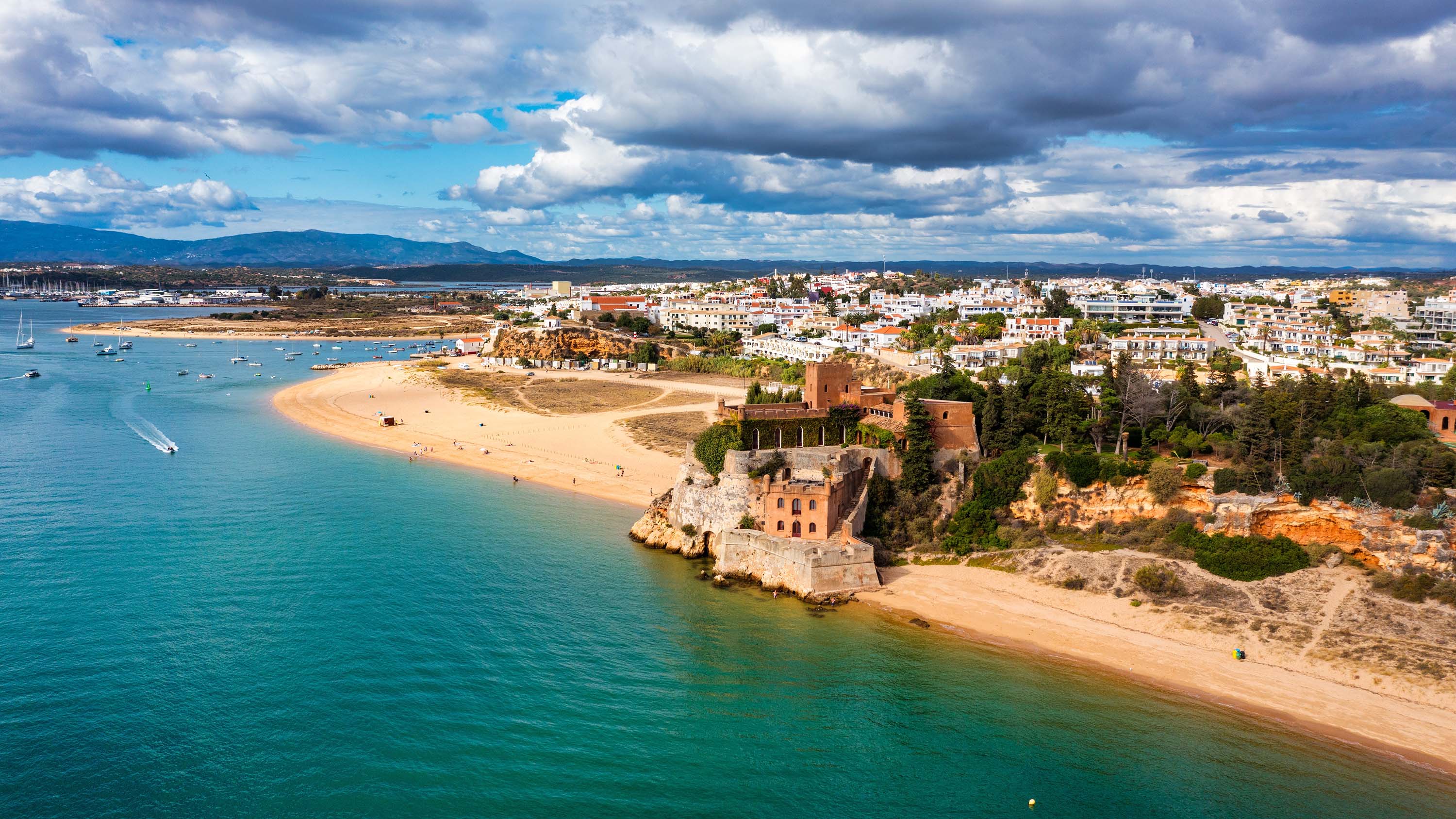 Ferragudo with the Praia Grande (the main beach) and the river Rio Arade, Algarve, Portugal