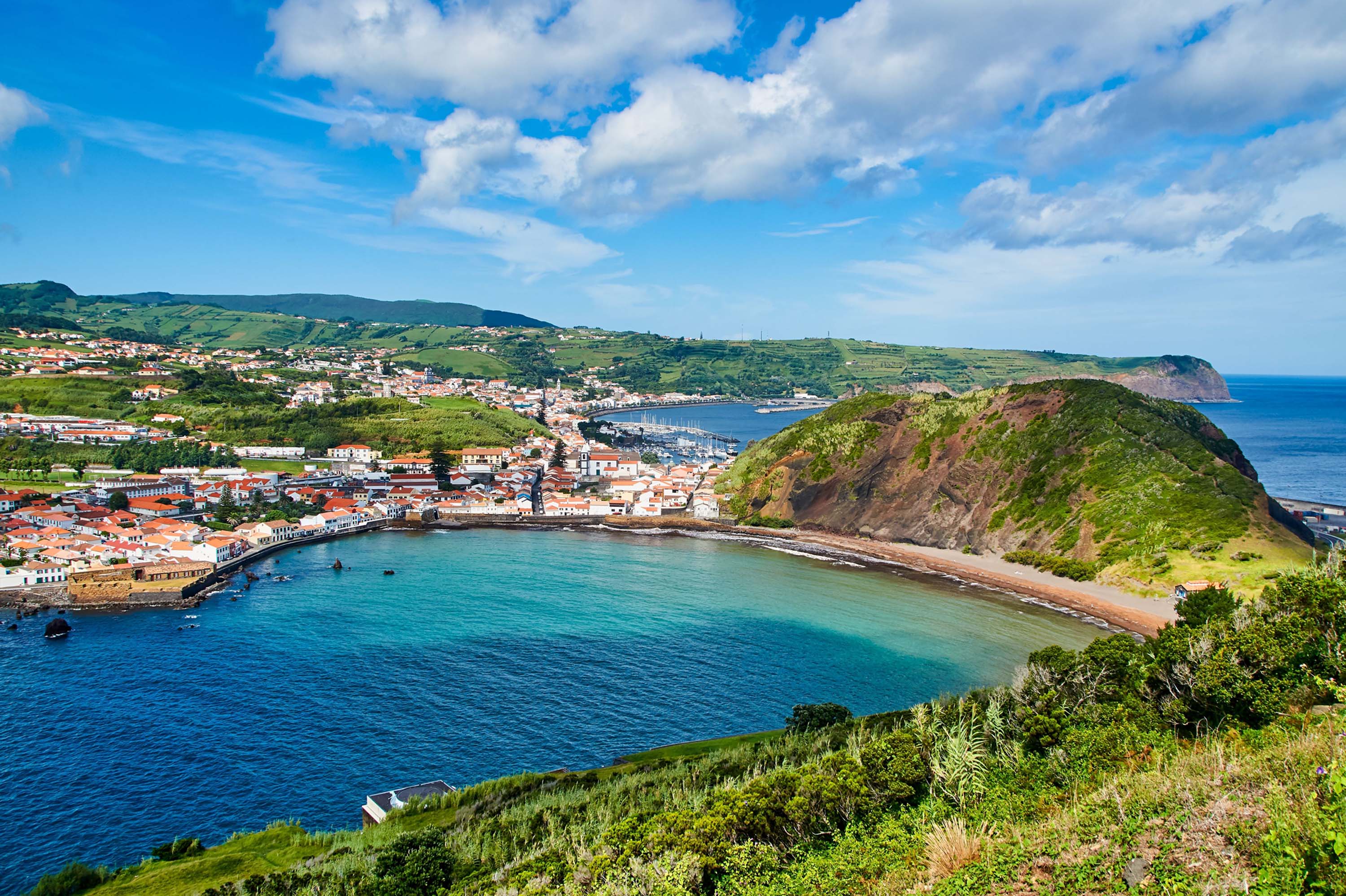 Horta city on Faial island of Azores surrounded by the beautiful ocean and hills