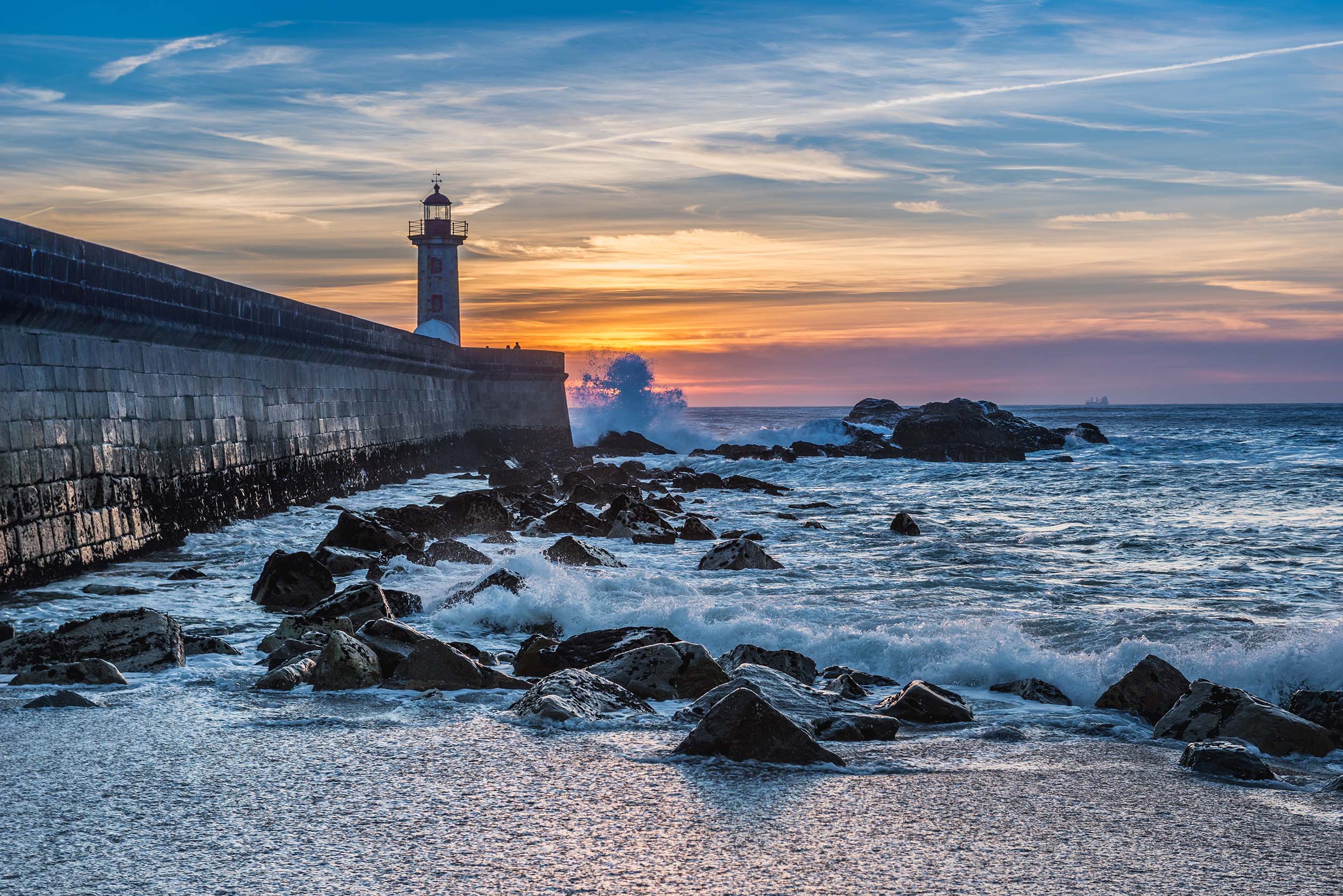 Sunset seen from beach in Foz do Douro parish in Porto city, Portugal