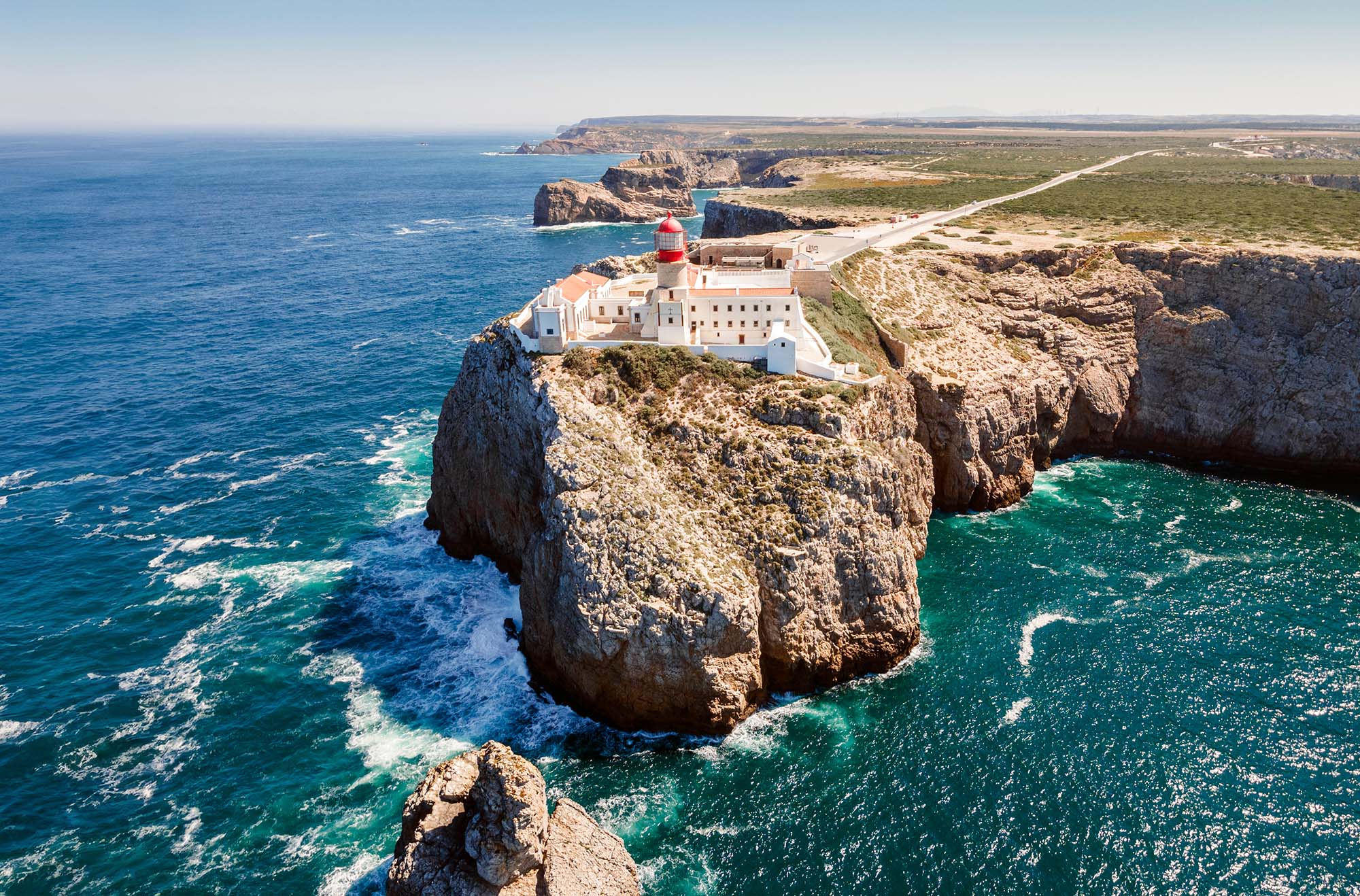 Beautiful lighthouse located on high cliffs of Cape St Vincent near Sagres, in the Algarve