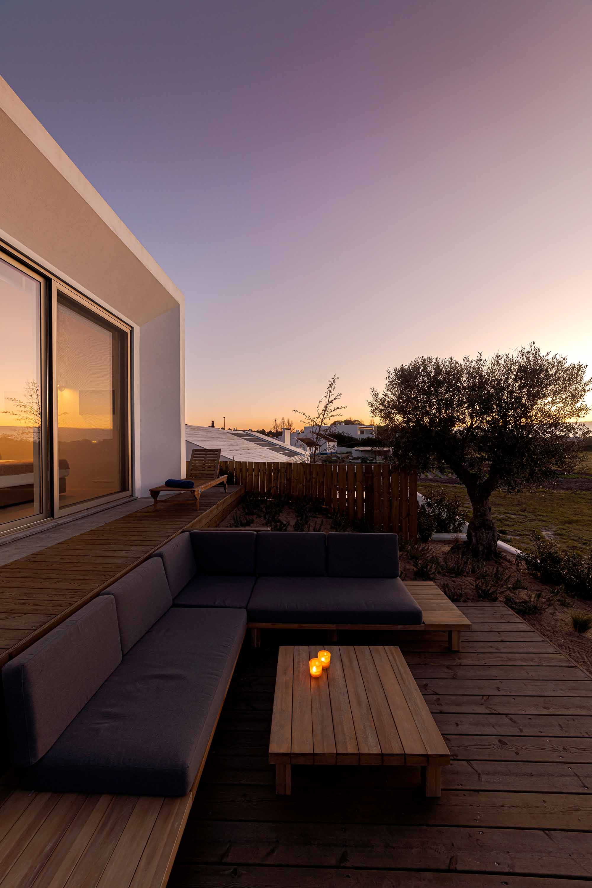 Relax corner with cushions in deck in modern villa terrace in Portugal