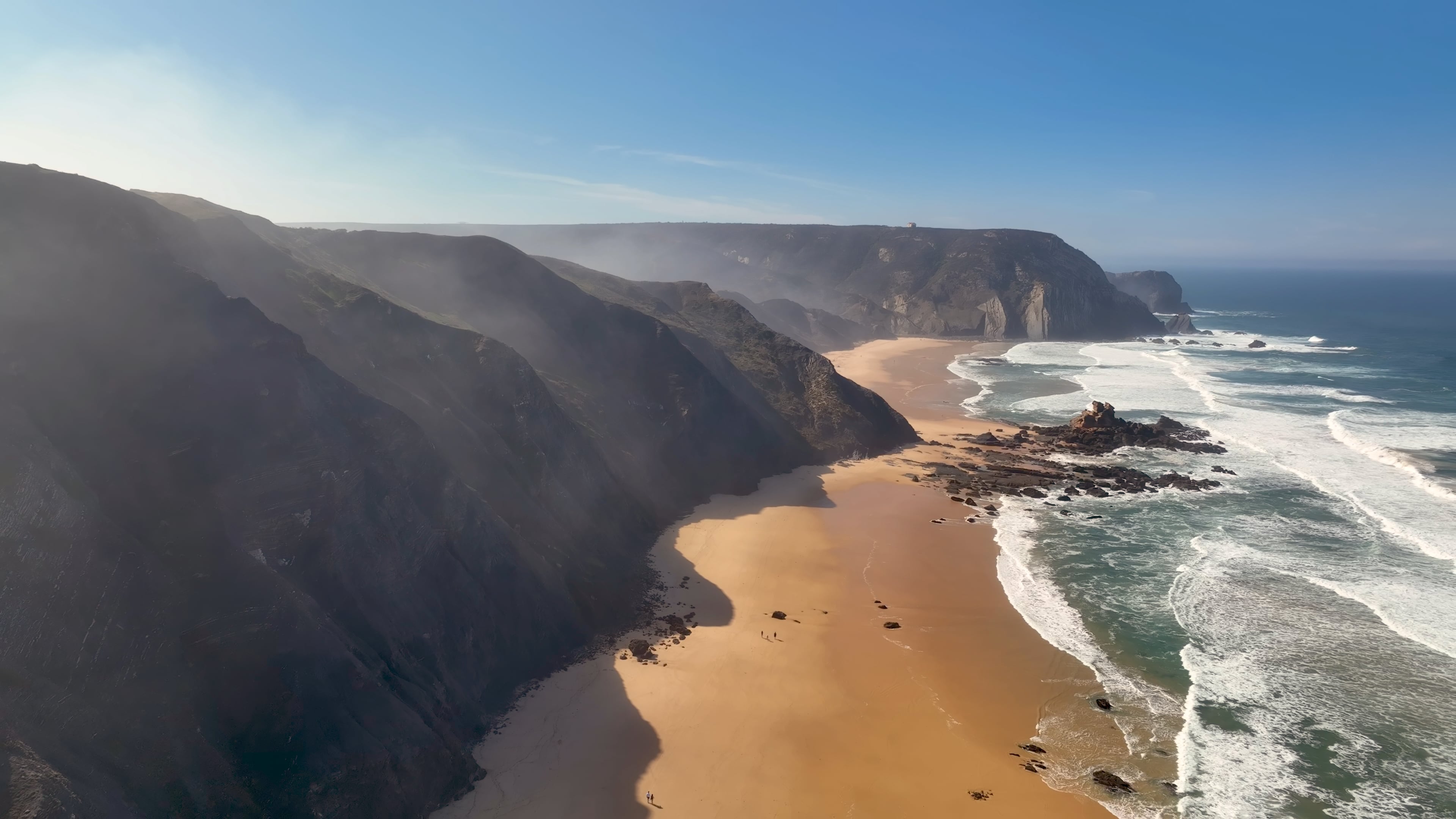 Vast strech of ocean and mountainous terrain in Portugal