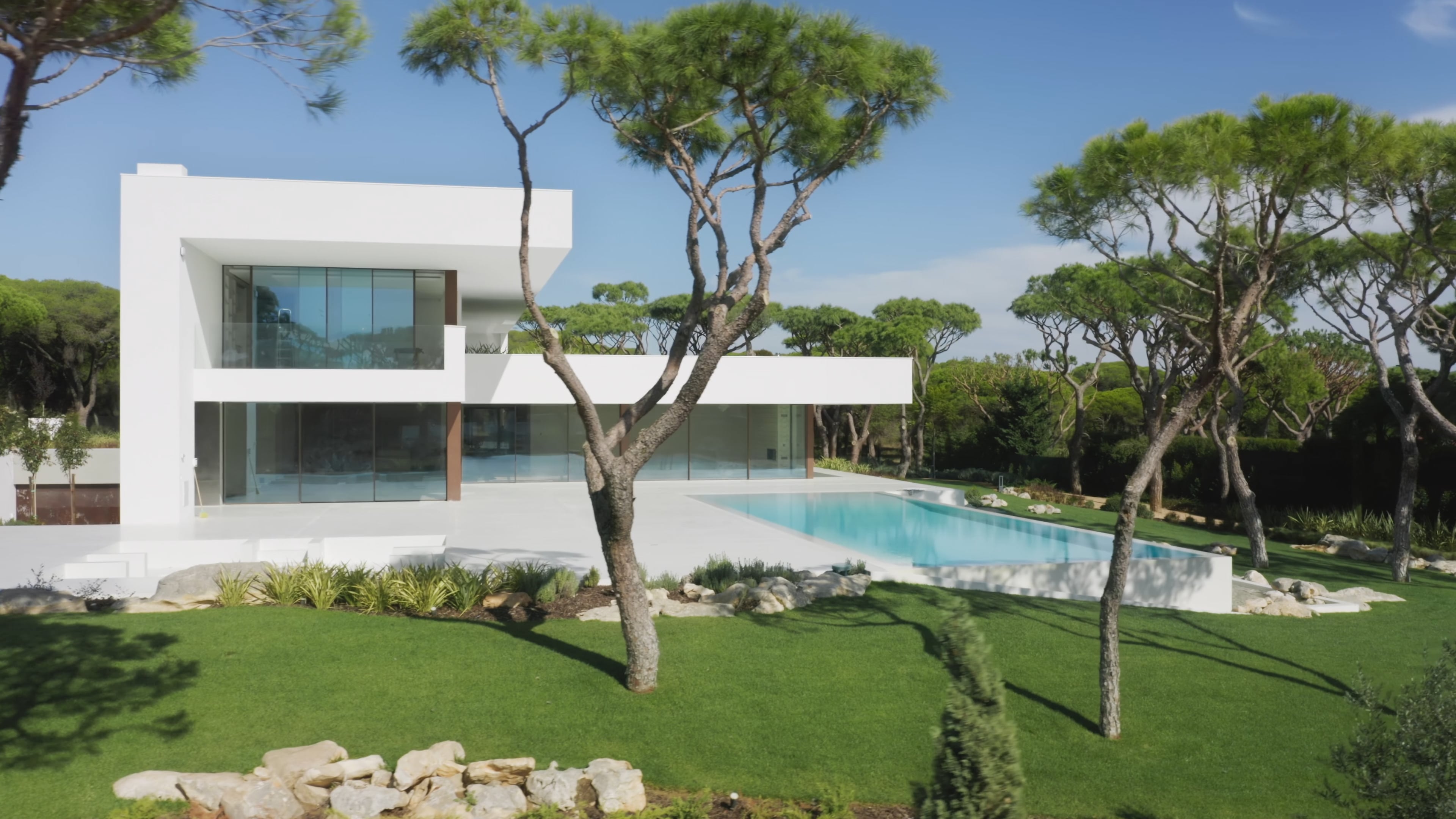 A modern luxury villa with a pool and garden in Portugal
