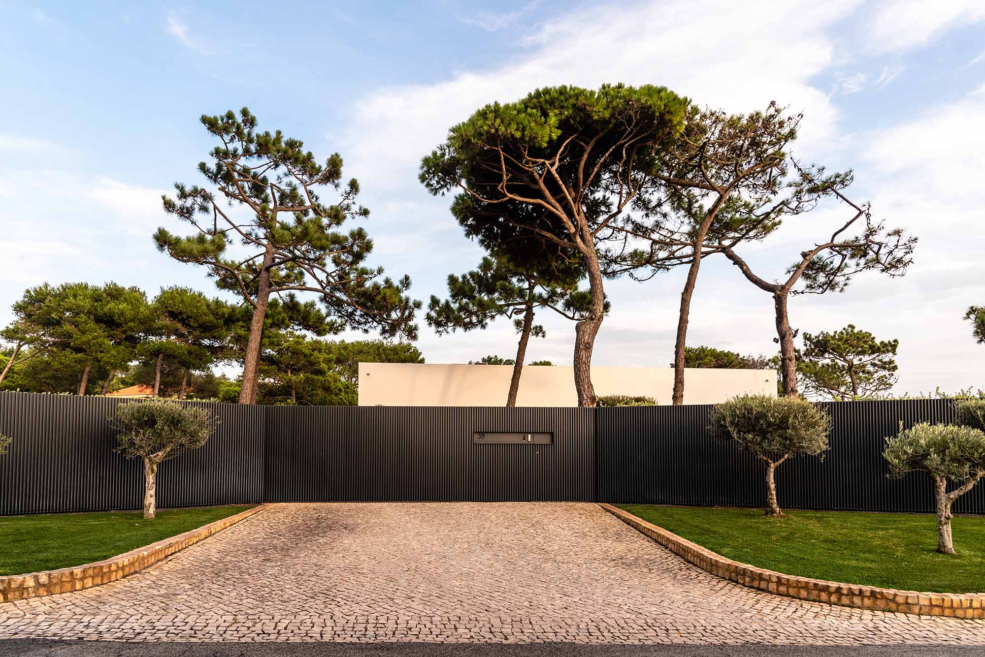 Stunning modern villa in Cascais, Portugal, featuring sleek architecture and lush landscaping