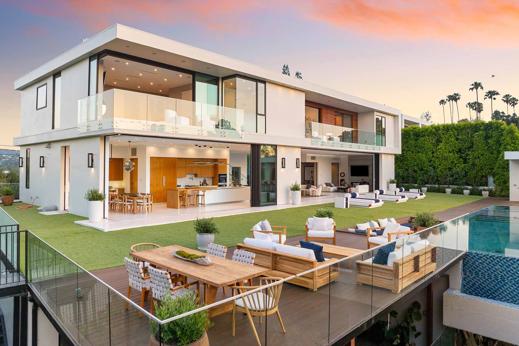 A luxurious home patio with outdoor pool and glass doors in Portugal