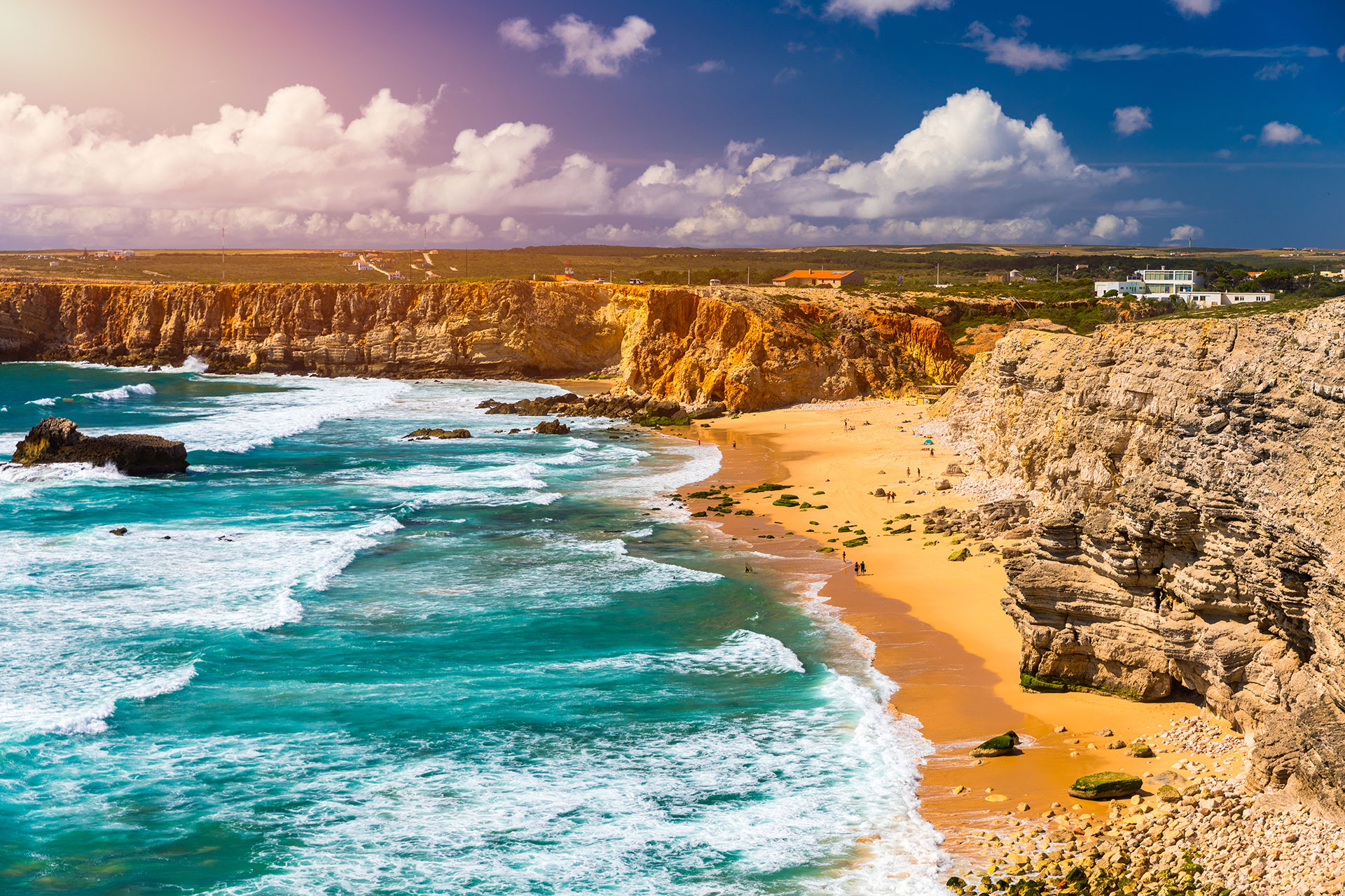 Panorama view of ocean waves crashing on Praia do Tonel beach at Cape Sagres, in the Algarve
