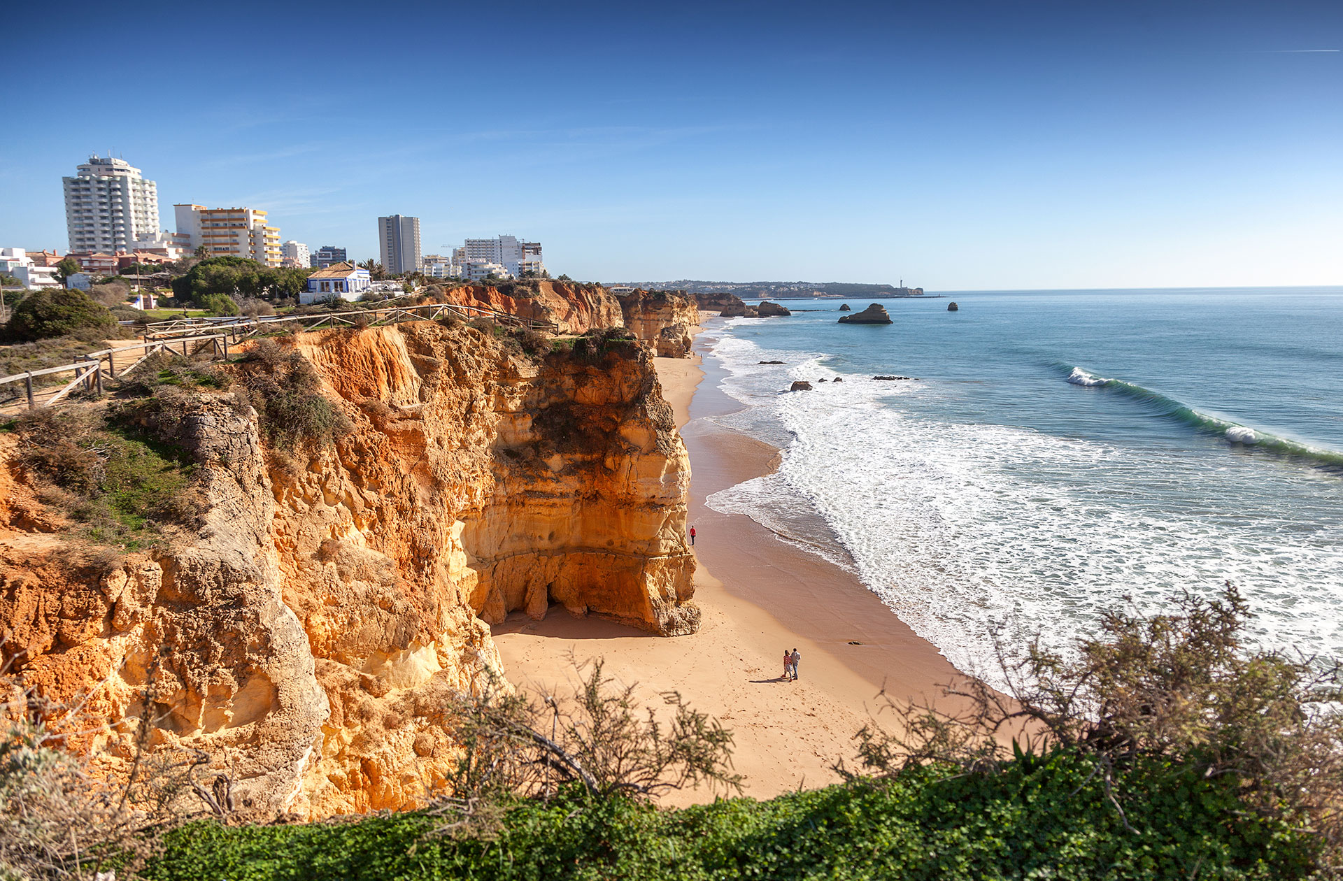 Rocky outcrops along the sands of Praia da Rocha in Portimao