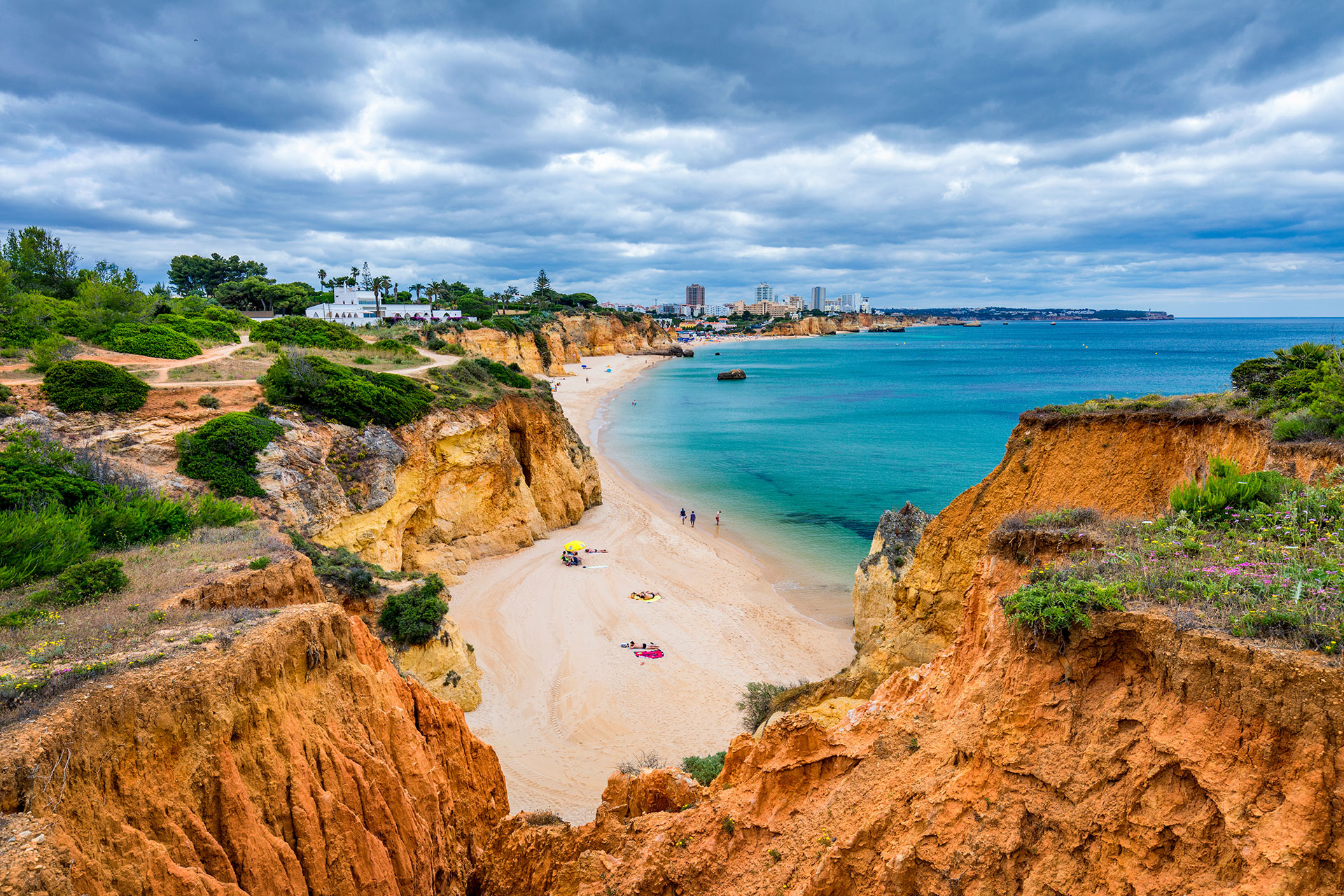 A secluded beach in Alvor surrounded by cliffs and a view of the ocean