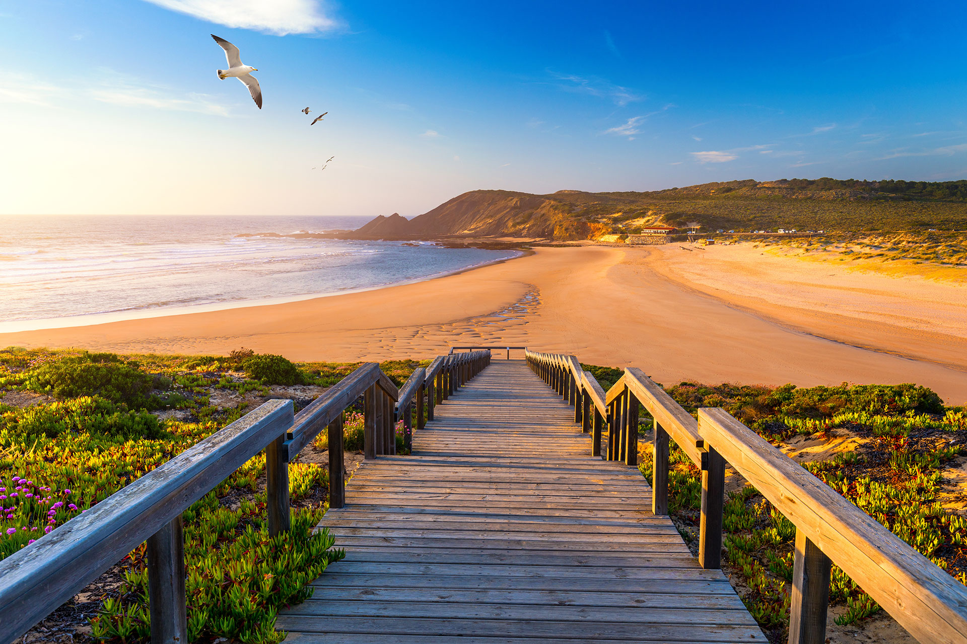 A peaceful view of the beach in Aljezur, naturally secluded by the cliffs