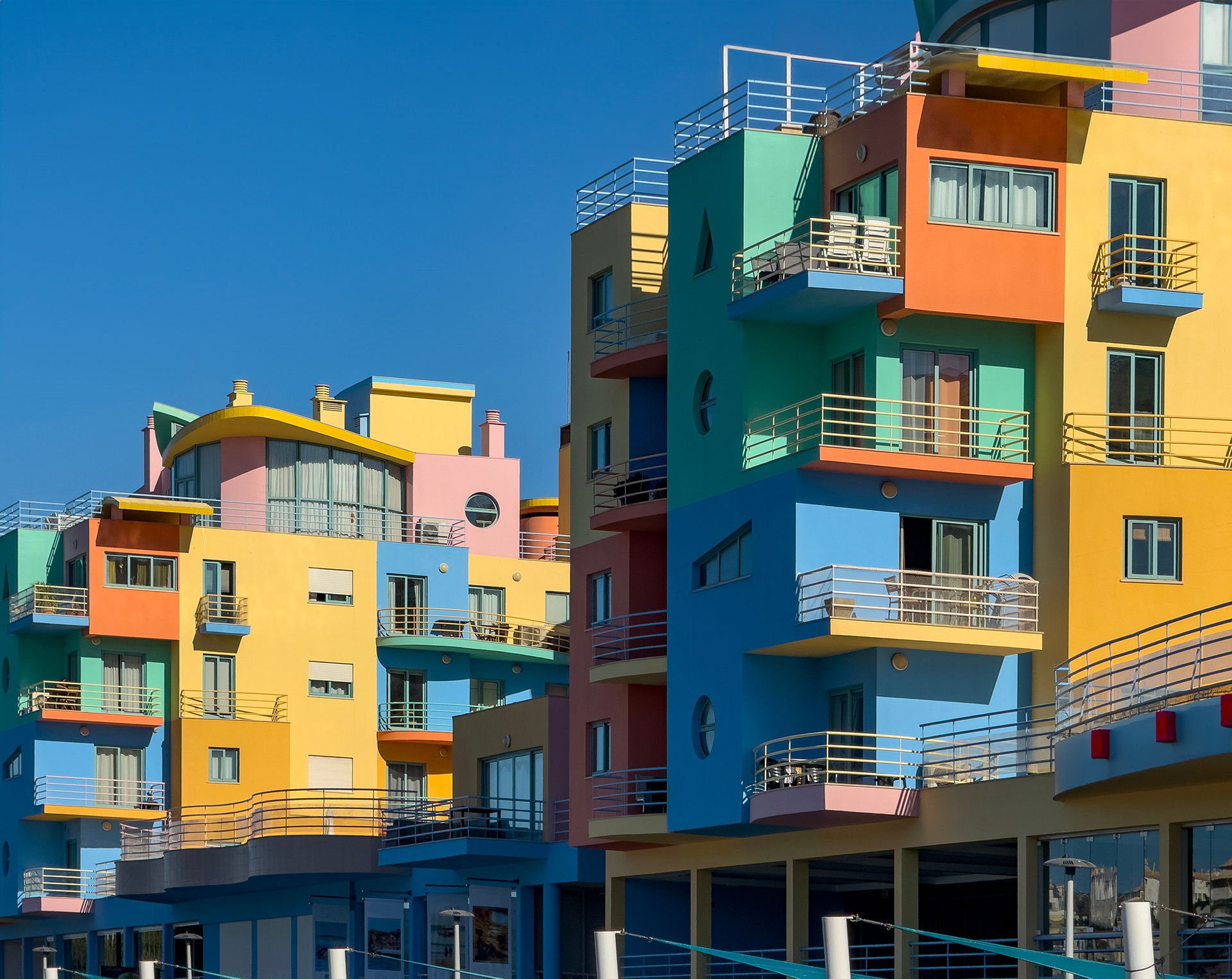 Colourful houses in Albufeira with blue skies