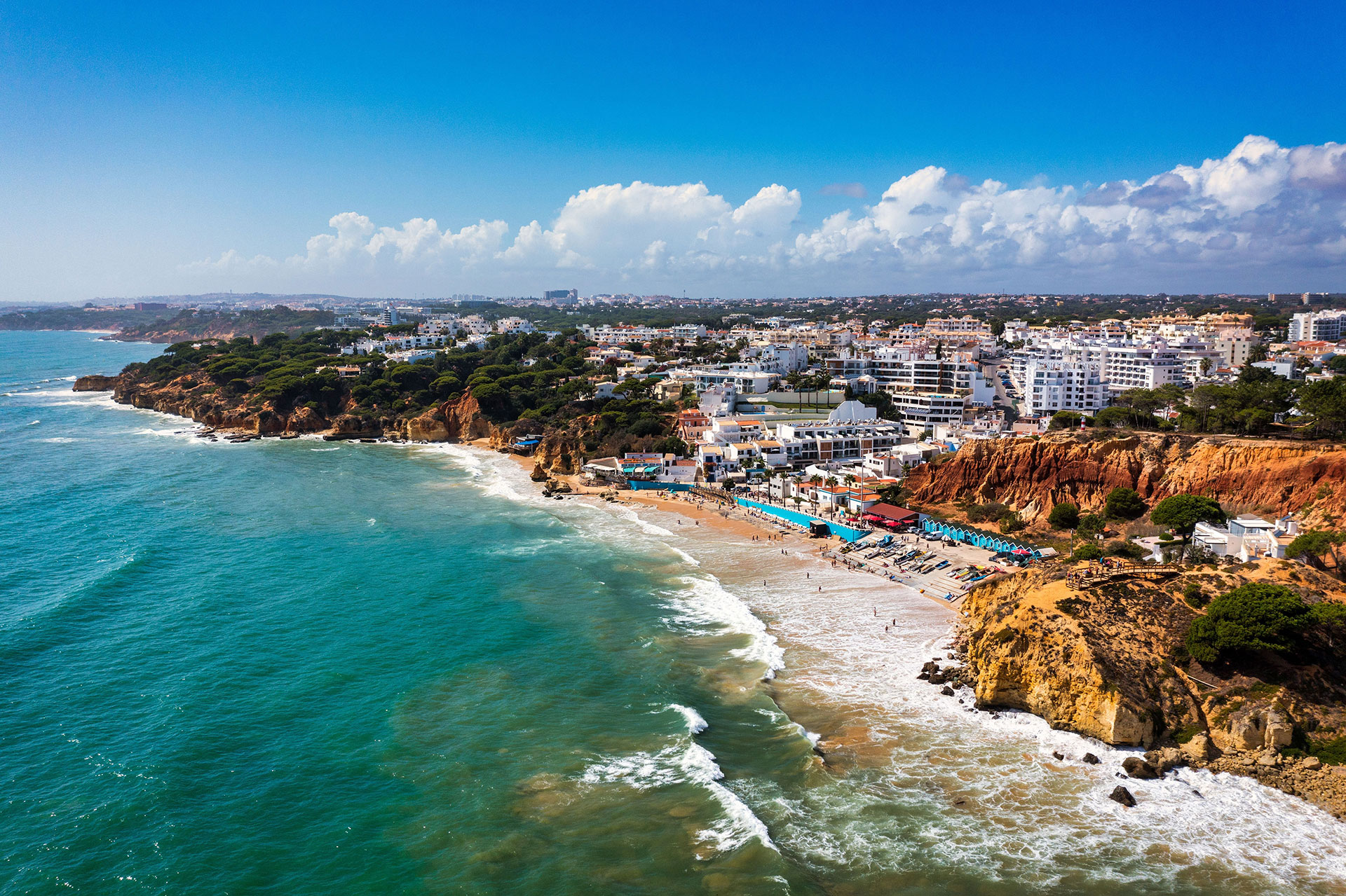 Coastal view of Albufeira's cliffs and traditional villas by the ocean