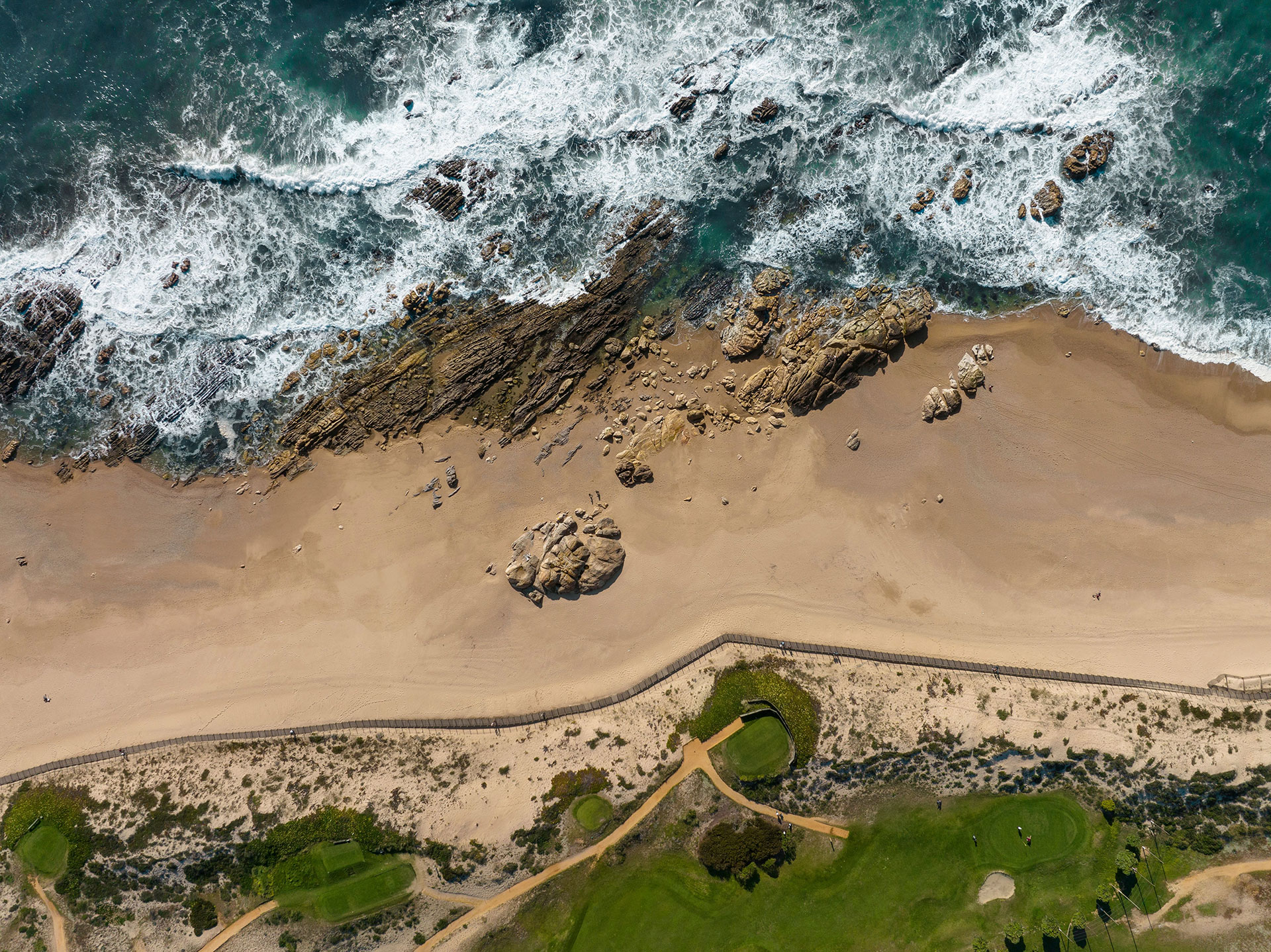 Aerial view of the beach, ocean and a golf course in Arcozelo 