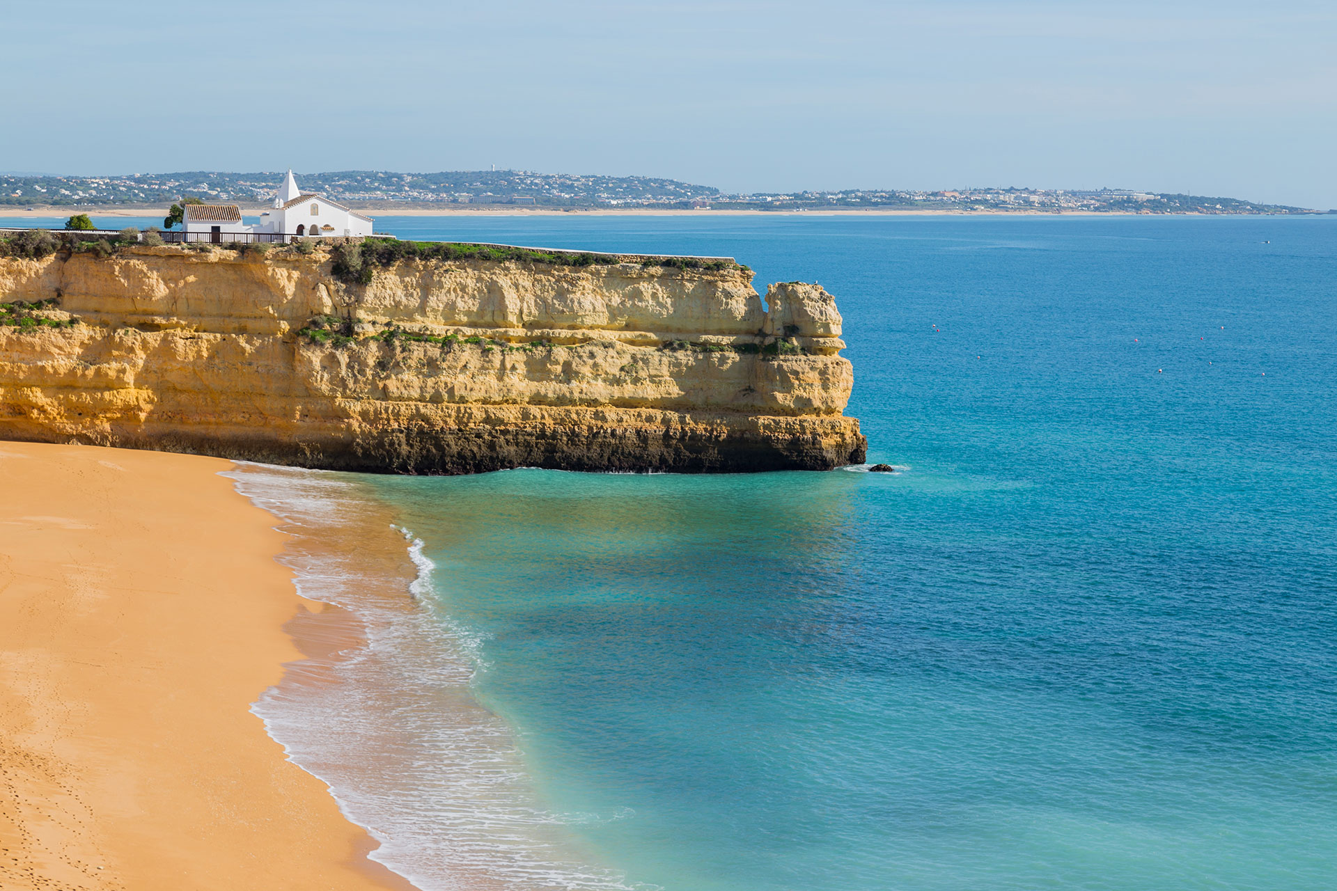 Coastal cliffs and the Atlantic ocean in Lagoa Portugal