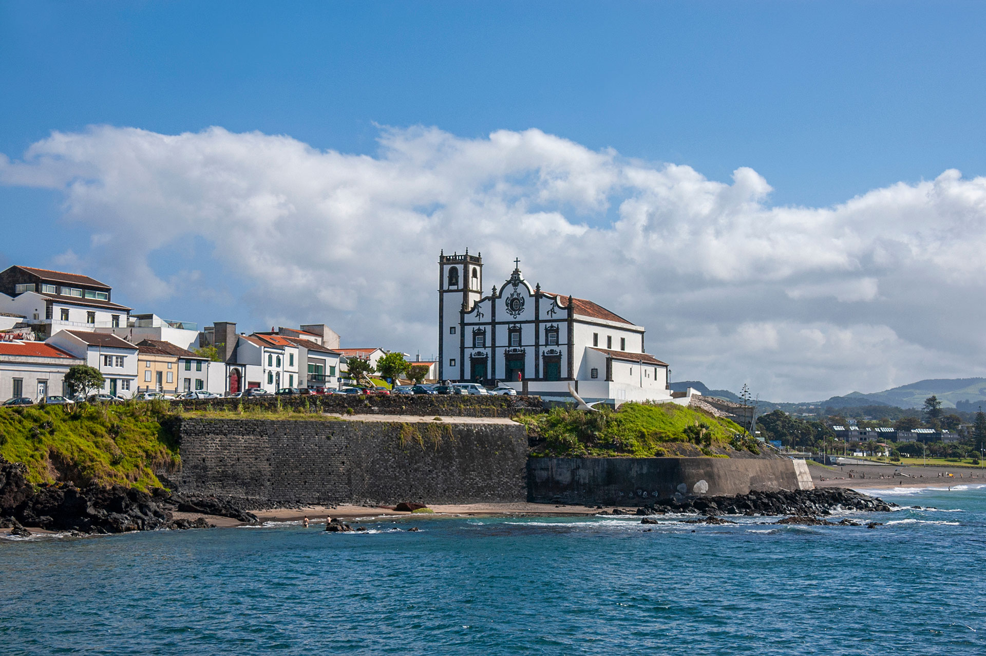 View of the beach and church of Sao Roque in Ponta Delgada