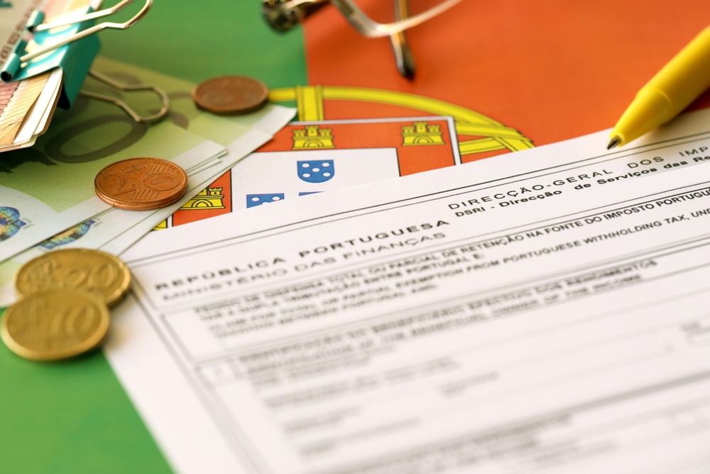 Portuguese tax document with euro notes and coins, set against a flag backdrop