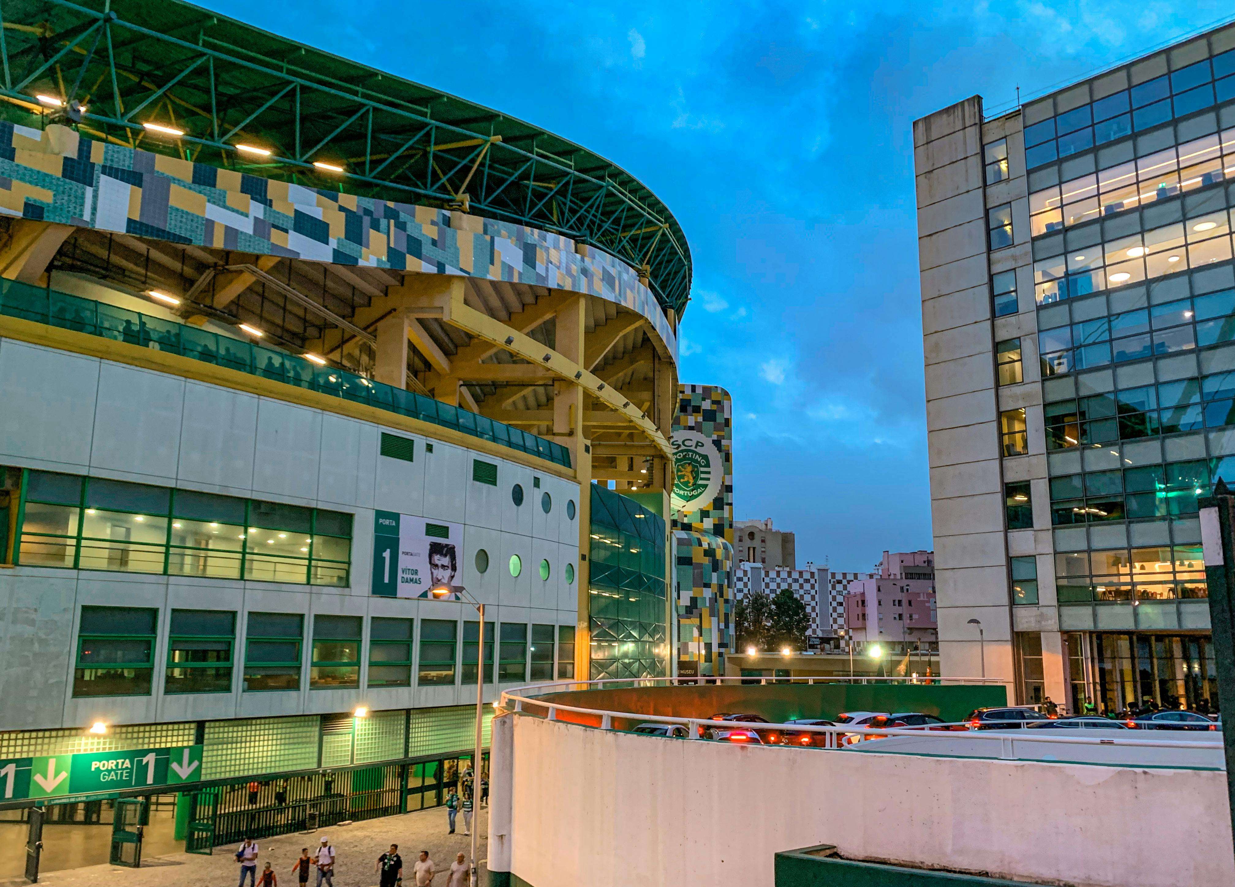 Exterior of Estádio José Alvalade, featuring its mosaic green and yellow facade and curved roof