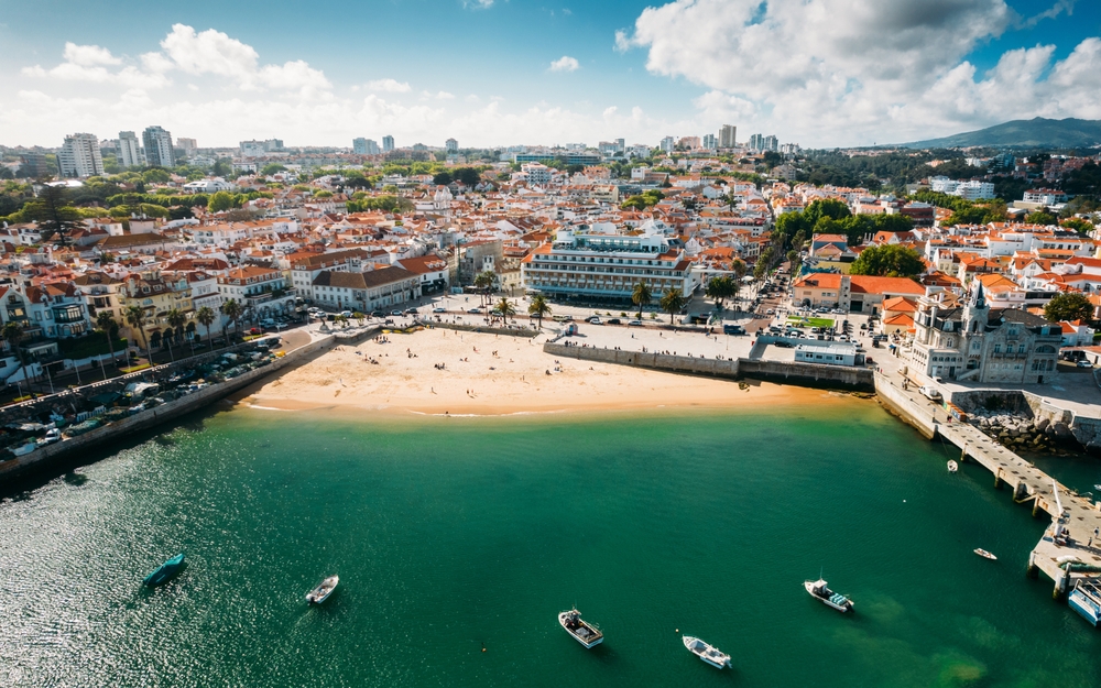 View of Praia da Ribeira beach and historic Cascais town from above