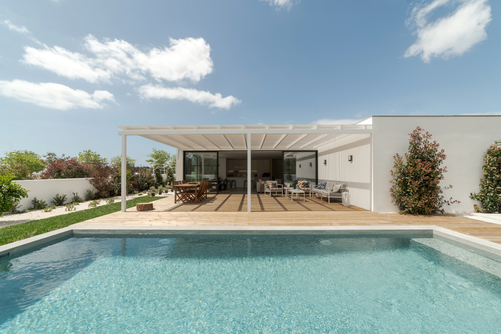 Modern villa with pool and deck with interior