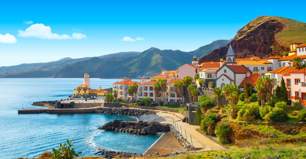 Colorful coastal village of Canical, with terracotta roofs nestled against steep green mountains