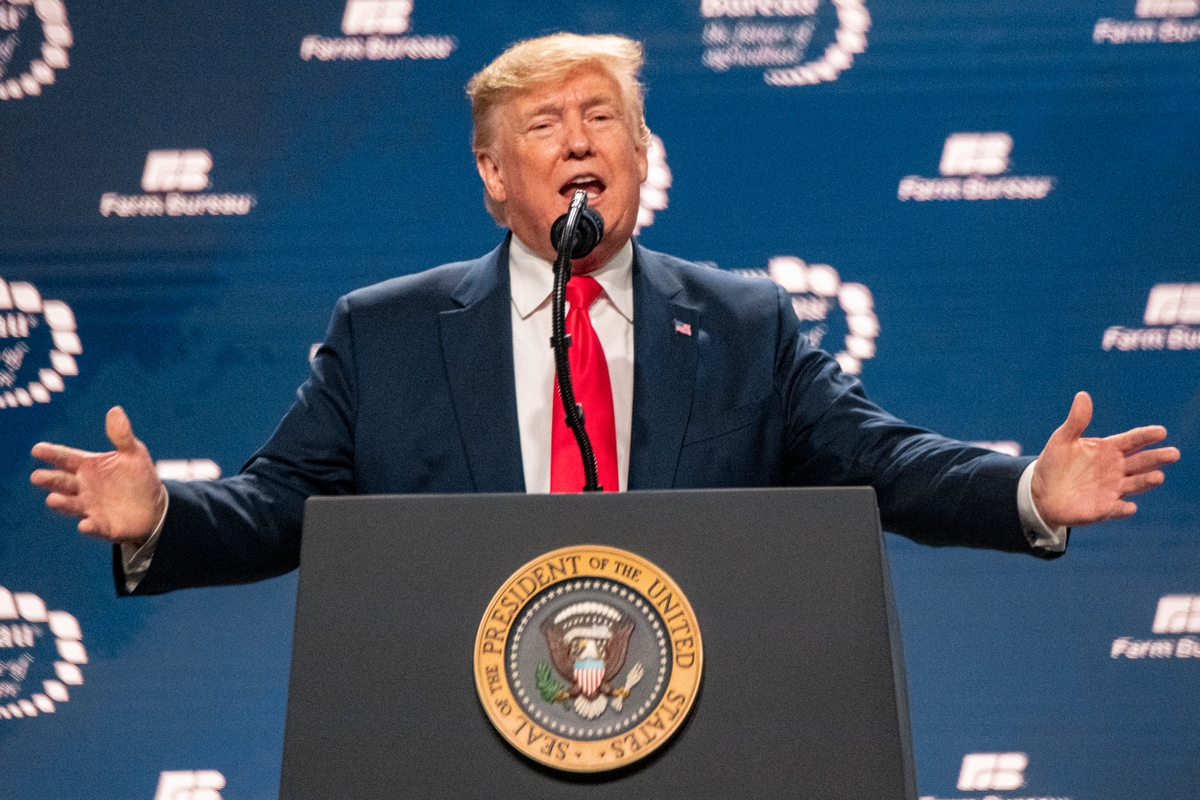 President Donald Trump speaking at a podium during an event in the United States