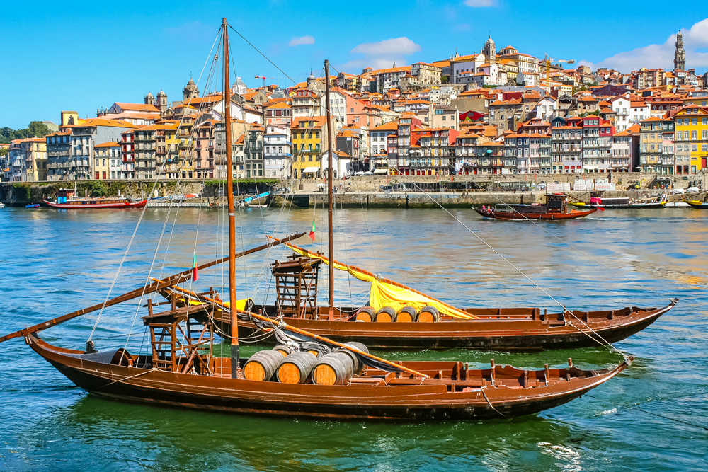 Traditional boats moored on the Douro River with Porto in the backgroud