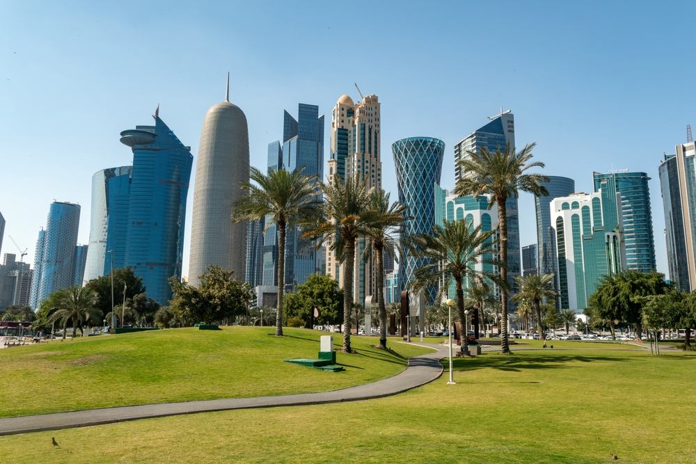 Tall modern skyscrapers tower over the central park in Doha in Qatar
