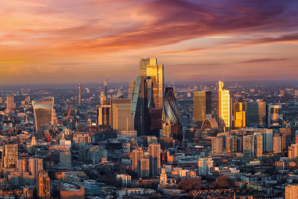 Panoramic view of City of London skyscrapers at sunrise with vibrant skyline