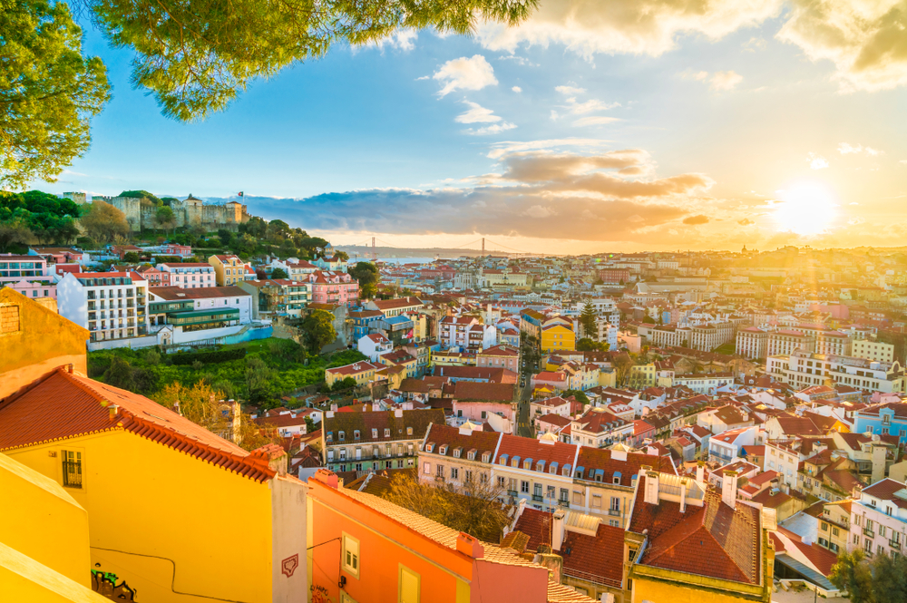 Panoramic, rooftop view of Lisbon at sunset