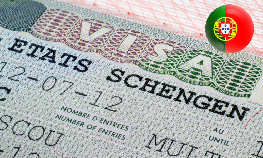 A close-up of a Schengen visa with a small Portuguese flag emblem in the top right corner