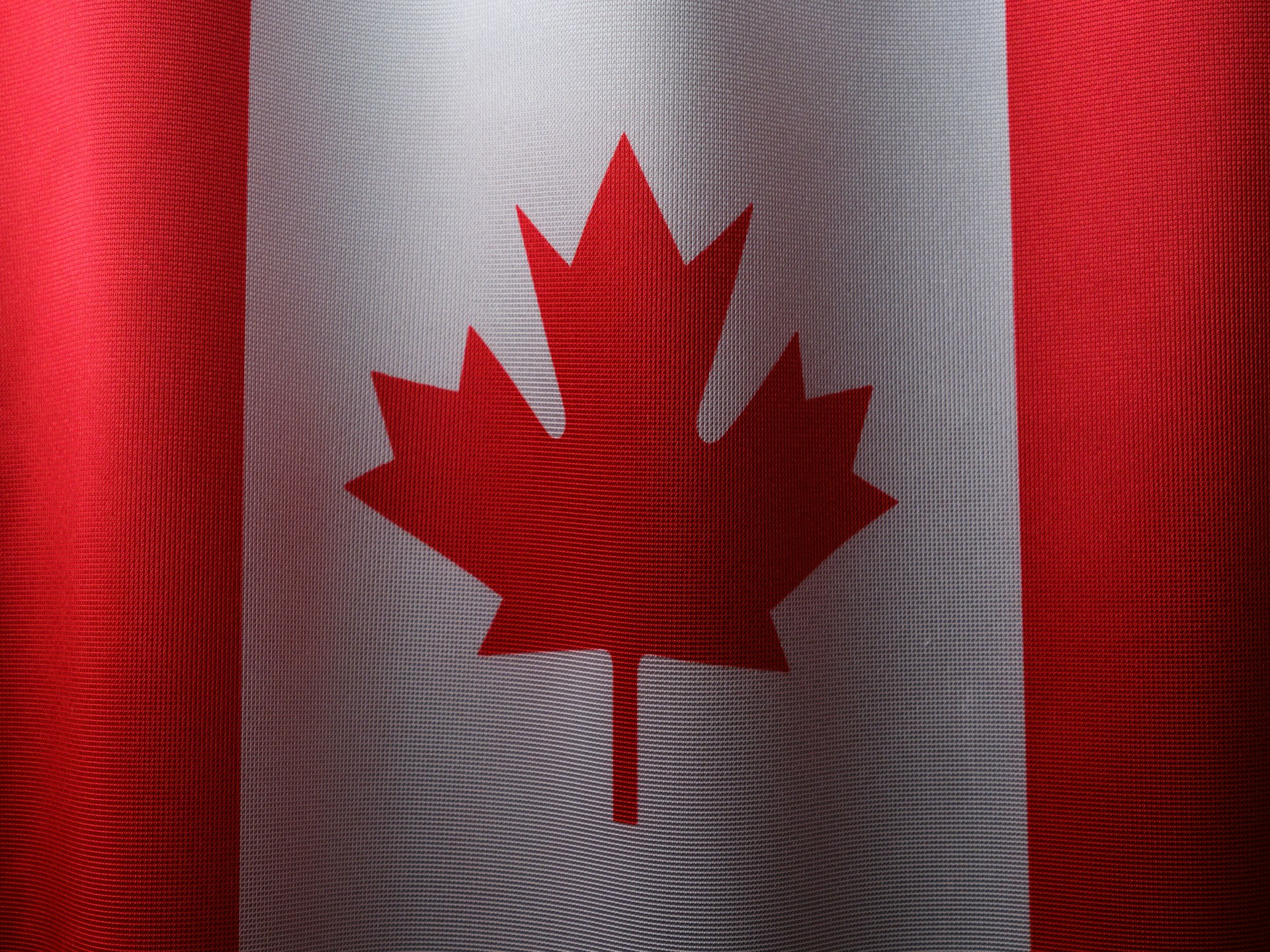 National flag of Canada featuring the red maple leaf on a white and red background