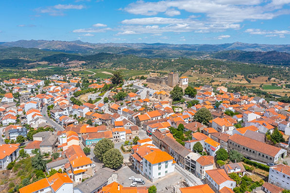 Hillside village of Belmonte with Medieval castle and surrounding green landscape