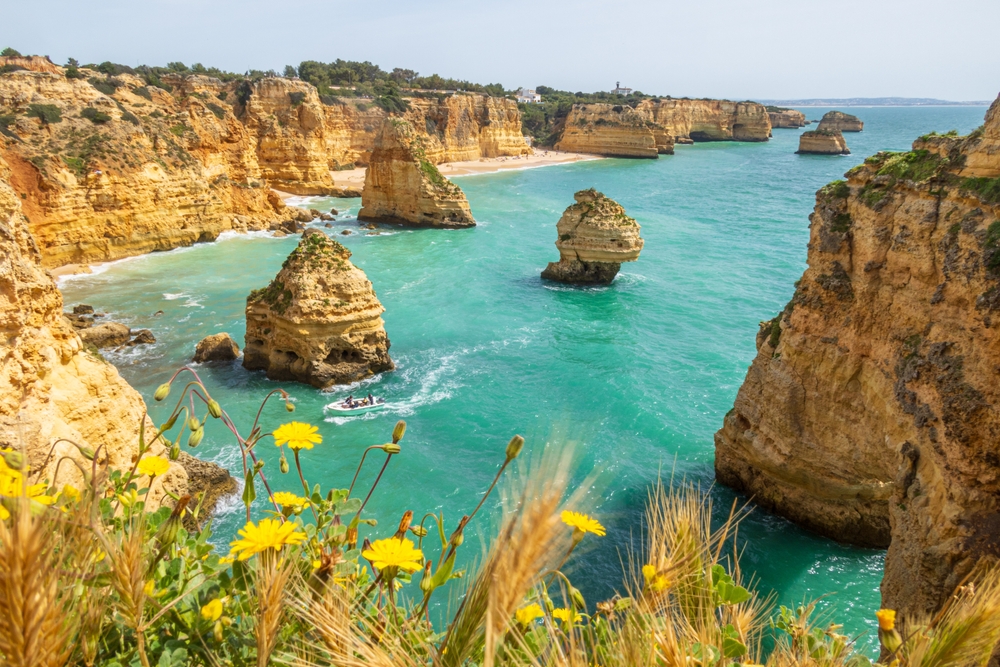 View over secluded beach and cliffs on the coast of the Algarve, Portugal