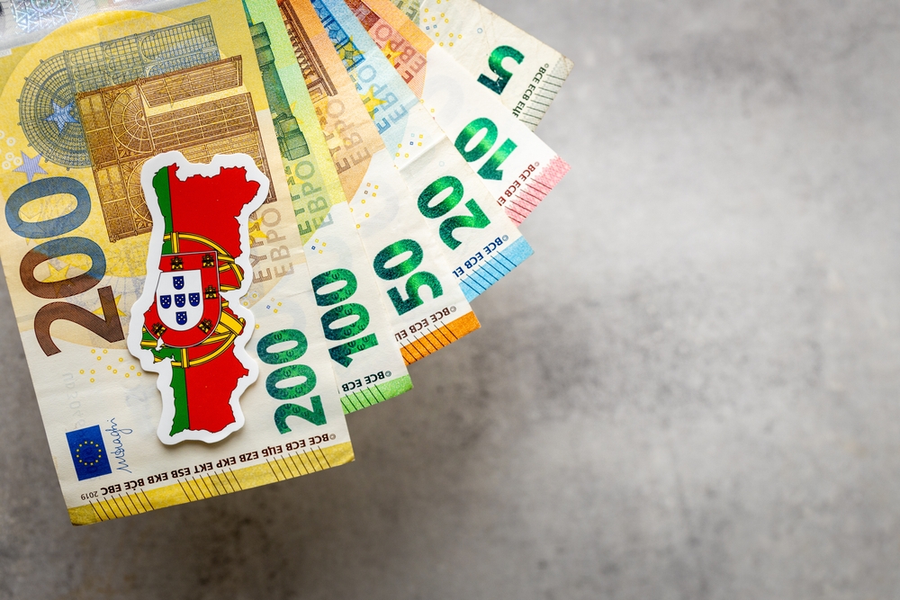 Euro currency notes with a Portugal flag
