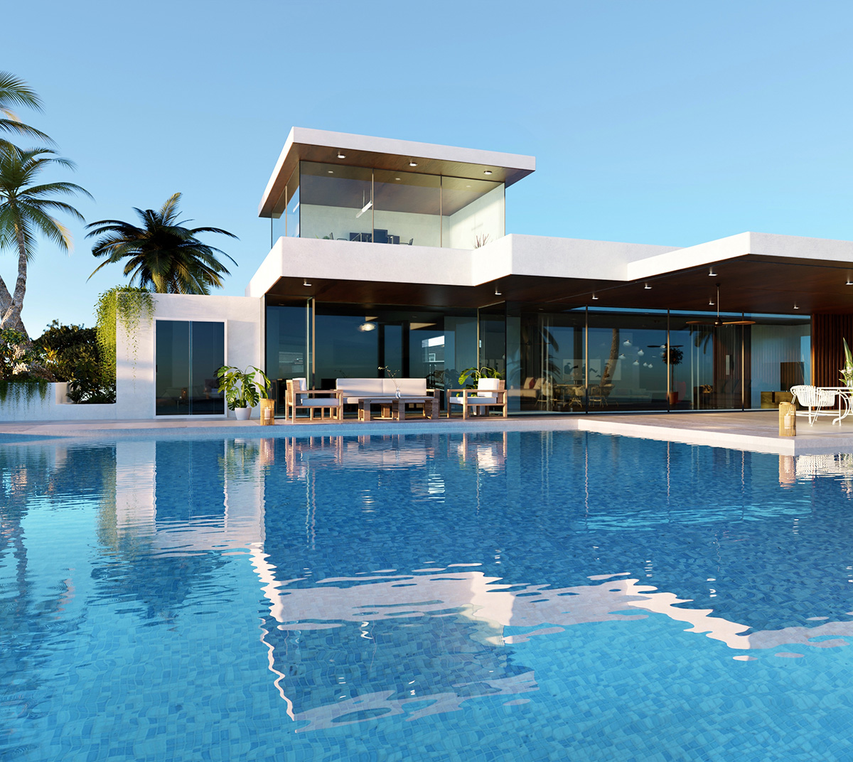 Ultra-modern white villa with large infinity pool and tropical palm trees