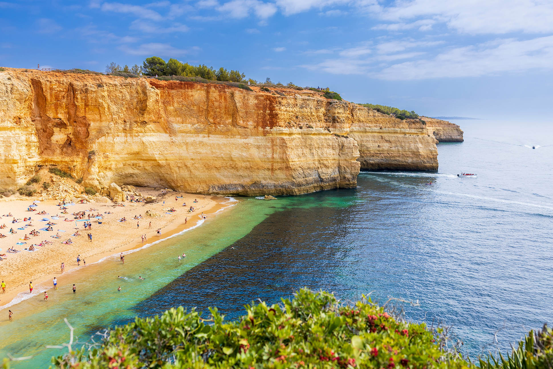 Striking view of the golden sands and clifftops at Benagil beach.