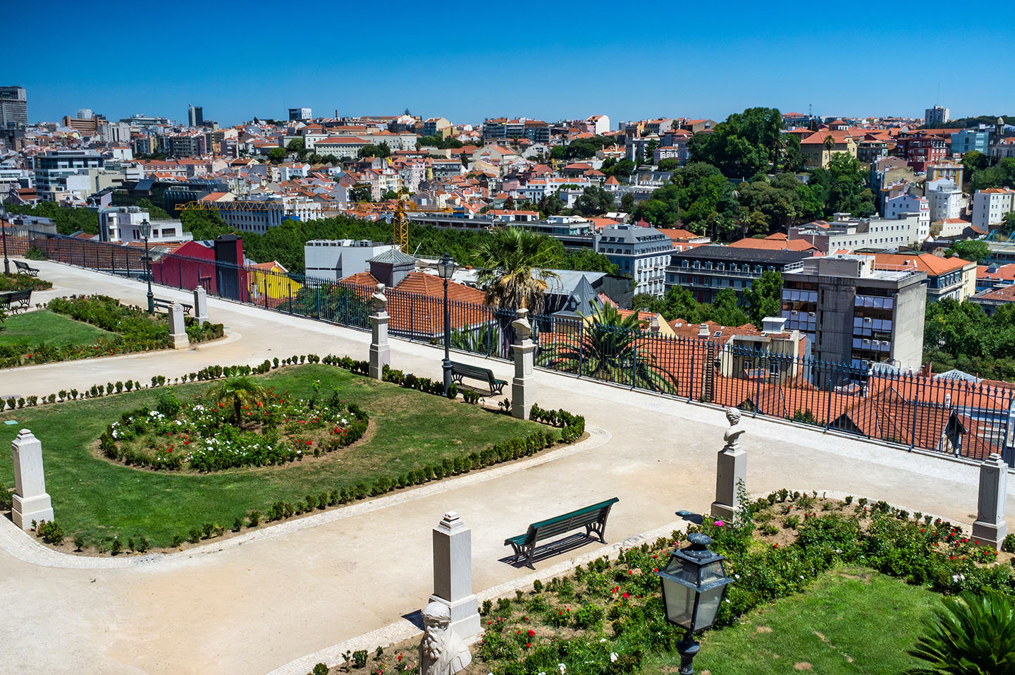 Manicured gardens of Miradouro de São Pedro de Alcântara overlooking the city of Lisbon
