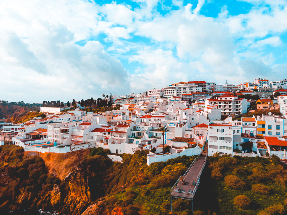 View over modern resort town in Portugal with classic white buildings