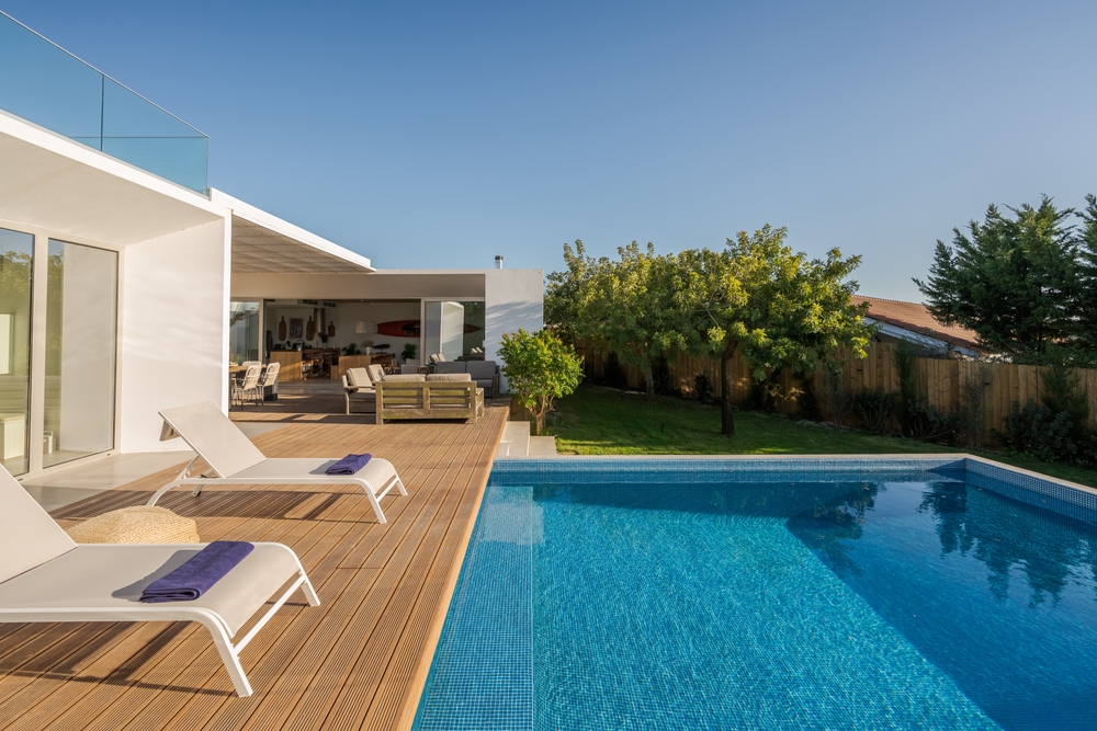 Exterior of modern open-plan villa in Portugal with swimming pool