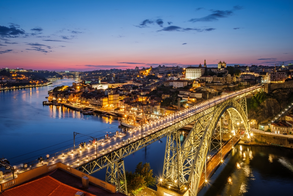 Porto at night with illuminated bridge and city