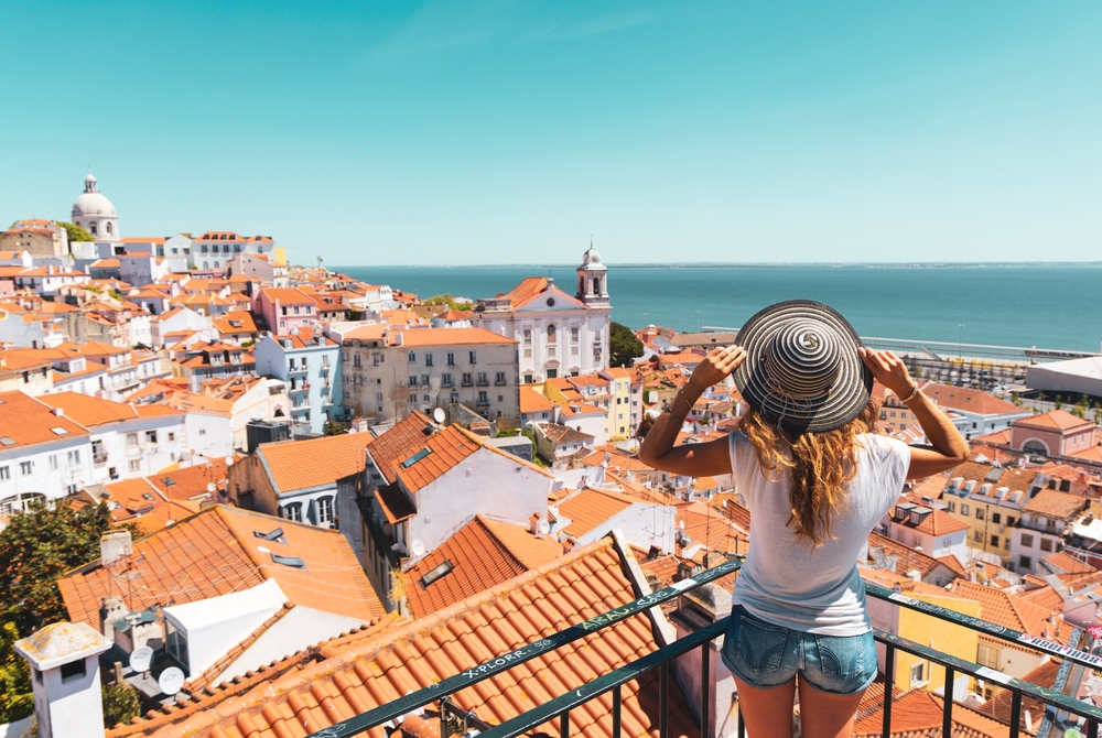 Portugal expat looking out over rooftops in Lisbon