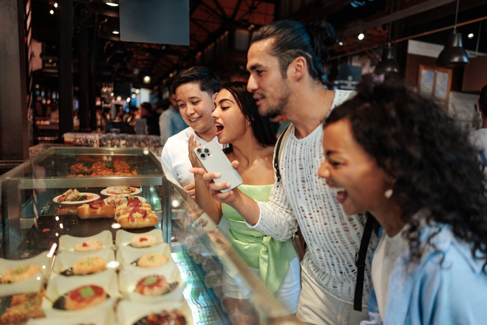 Group of expats exploring a food market in Portugal