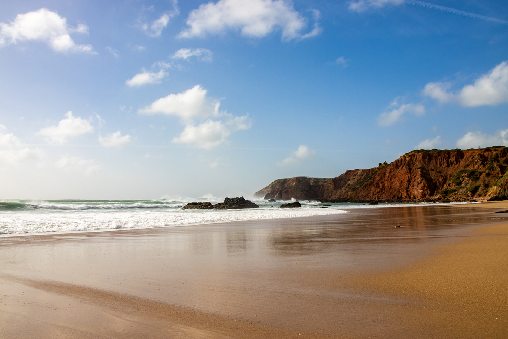 beach in the Algarve Portugal with rocky cliffs