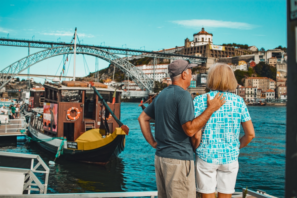 Elderly couple enjoying view of River Douro in Porto, Portugal
