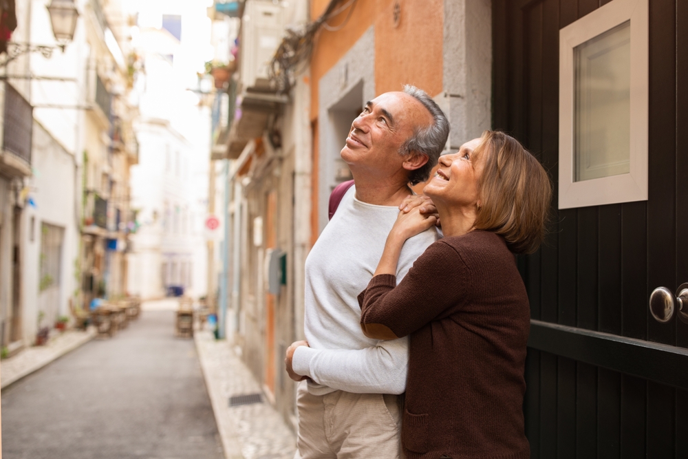 Elderly couple exploring streets in Portugal