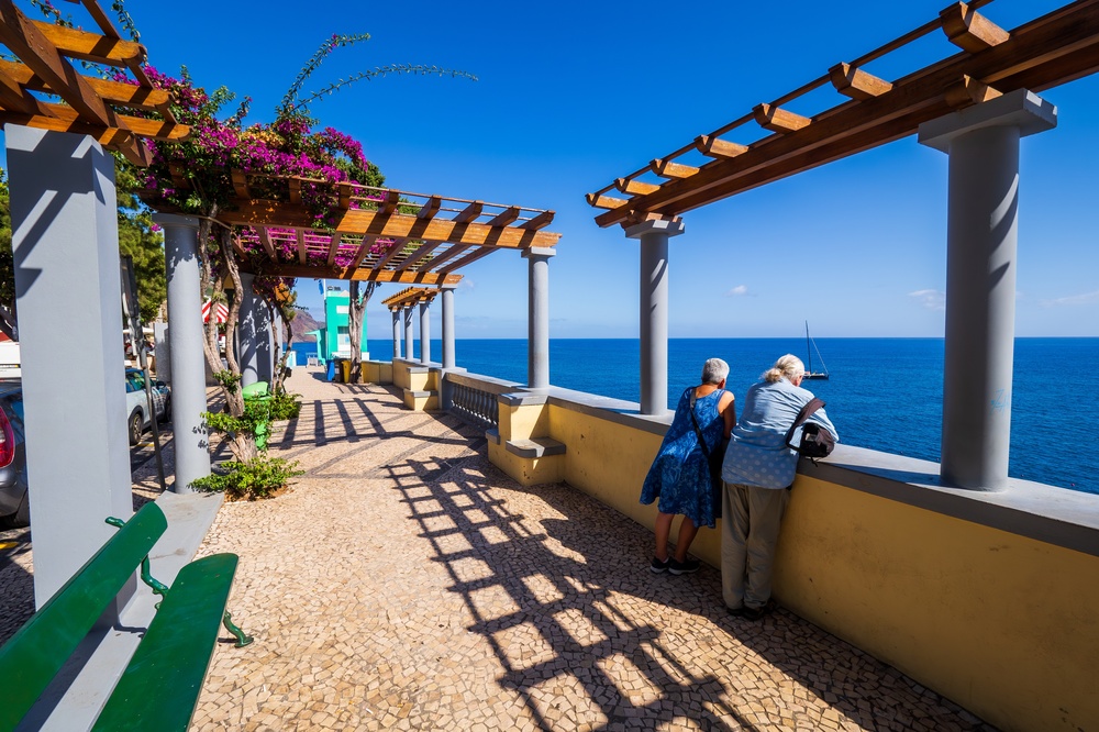 Elderly couple enjoying ocean view in Portugal