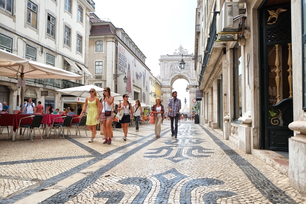 Tourists exploring Lisbon streets in Portugal