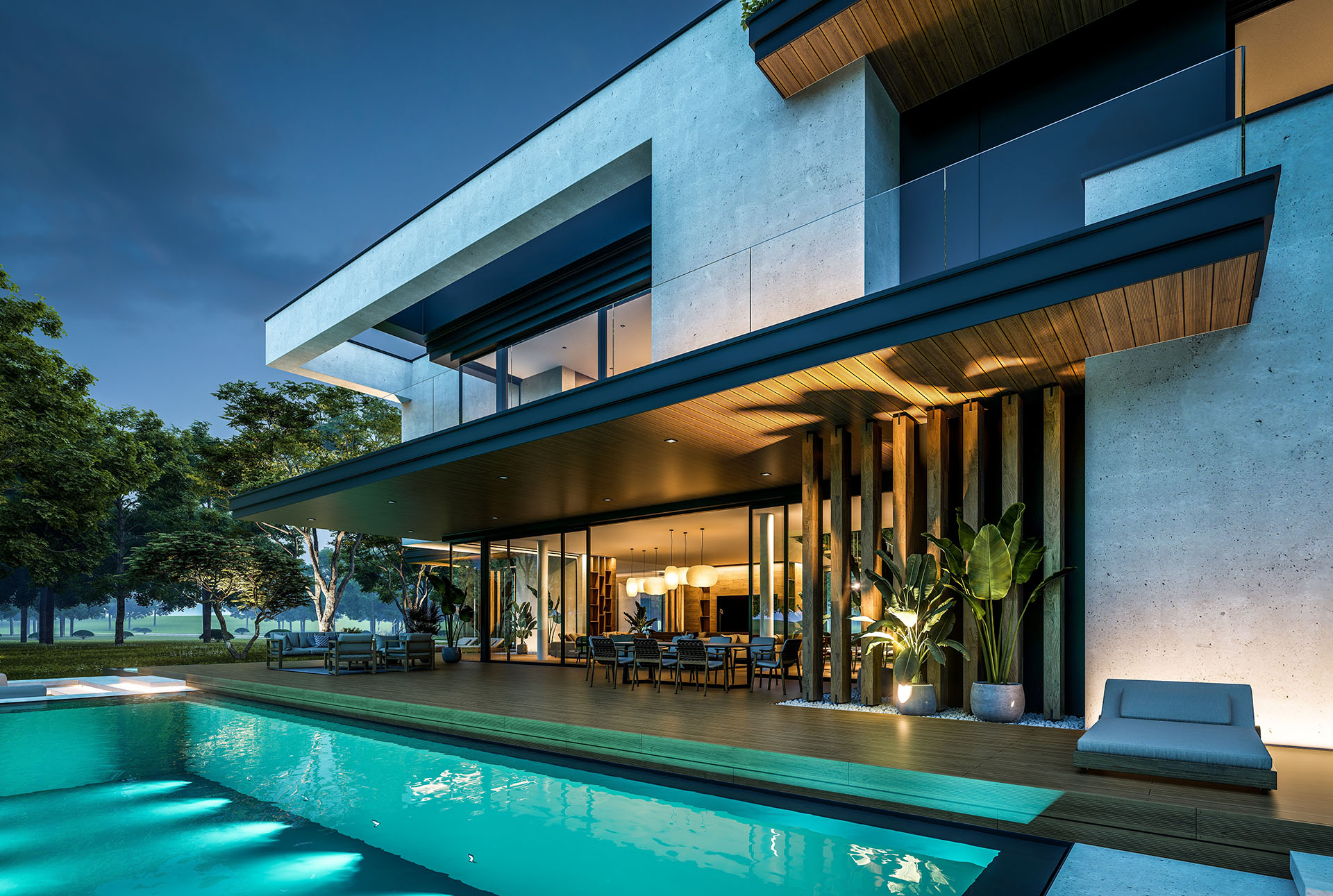 Modern luxury home with an illuminated pool and outdoor lounge area under a dusk sky