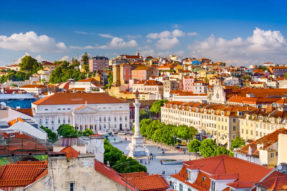 Rossio Square in Lisbon featuring the Column of King Pedro IV and colorful city buildings