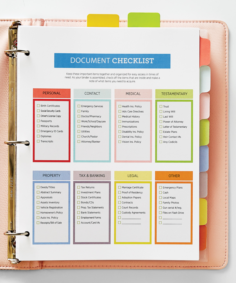 A three-ring binder opened to a document checklist for personal documents, contacts, medical, taxes and banking, legal, and more.